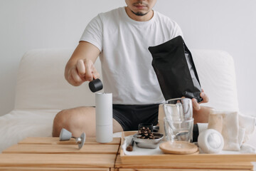 Step by step of Asian man making espresso with hand press tools.