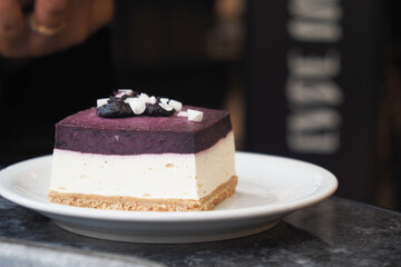 A Scrumptious Arrangement of Layers of Berry Cheesecake Beautifully Served on a Plate