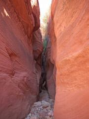 Approaching famous Buckskin Gulch canyon entrance by Wire Pass in layered red rock sandstone walls