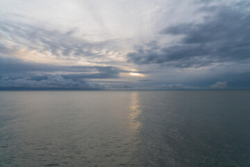 View of the Black Sea on the coast of Sochi against the sunset sky, Sochi, Krasnodar Krai, Russia