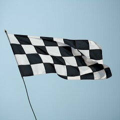 A checkered flag waves in the air, symbolizing the end of a race, with a clear blue sky in the background.
