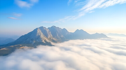 Majestic Mountain Range Piercing Through Clouds