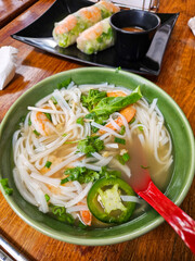 Plate of hot Pho in a Vietnamese food restaurant, meal