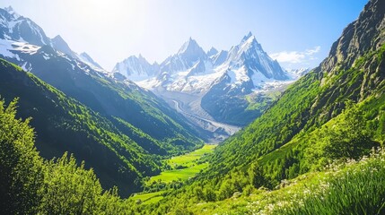 Majestic mountain range with snow-capped peaks and lush green valleys.