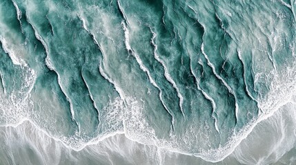 Obraz premium Mesmerizing Tidal Waves: An Aerial Perspective of the Crashing Ocean