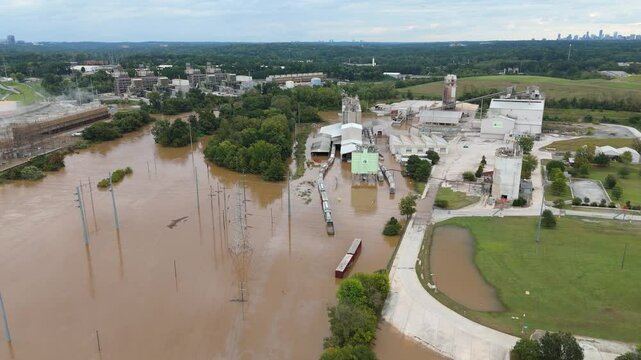 Drone shot pushing in on the Chattahoochee River flooding from Hurricane Helene in Atlanta, Georgia.