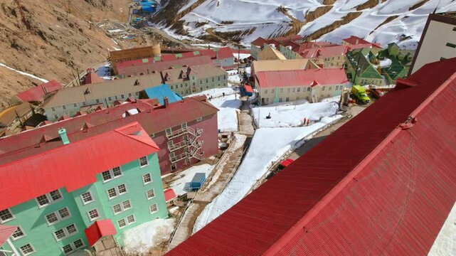 Drone flying over buildings at the Sewell town restauration project, in Chile