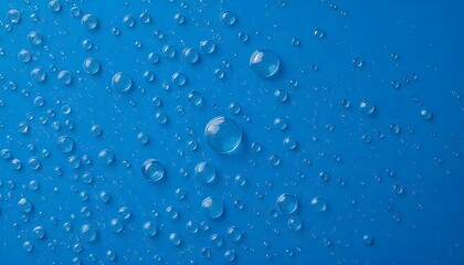 Drops of water on a blue backdrop with texture featuring lifelike microdroplets