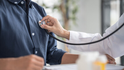 Medical Exam Doctor Monitoring Patient's Pulse Rate