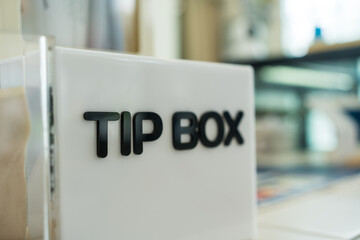 Close up of a tip box in a cafe