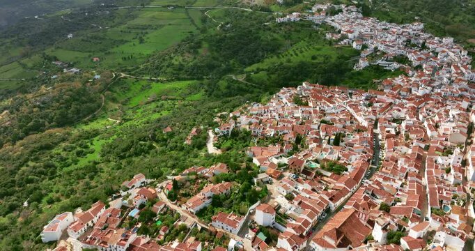 Beautiful cinematic drone view of Gauc&iacute;n City in the mountains of Spain, Europe. Cloud shadows are covering mountains around. Tilting up camera movement. High quality 4K prores footage. Sunny weather.