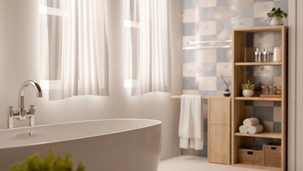 A modern luxury bathtub with a silver faucet is in a comfortable contemporary bathroom.