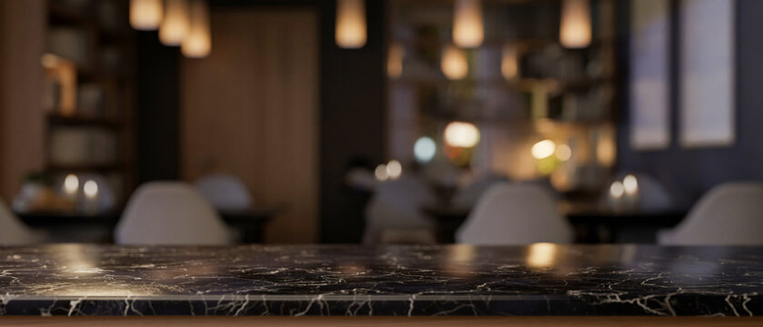 A luxury black marble tabletop with a blurred background of an elegance restaurant at night.
