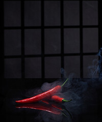 large cayenne pepper which is definitely spicy and photographed with a window background and a dim atmosphere