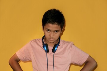 A teenager is making an angry gesture.