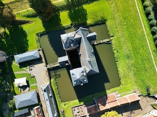 Aerial view of historic castle and moat.