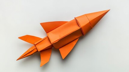 Orange Paper Airplane Origami Craft on White Background
