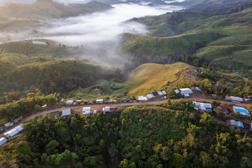 Landscape of Morning Mist with Mountain Layer at north of Thailand. mountain ridge and clouds in...