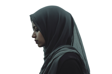 Profile of a woman in a hijab, exuding grace and calmness against a white isolated background.