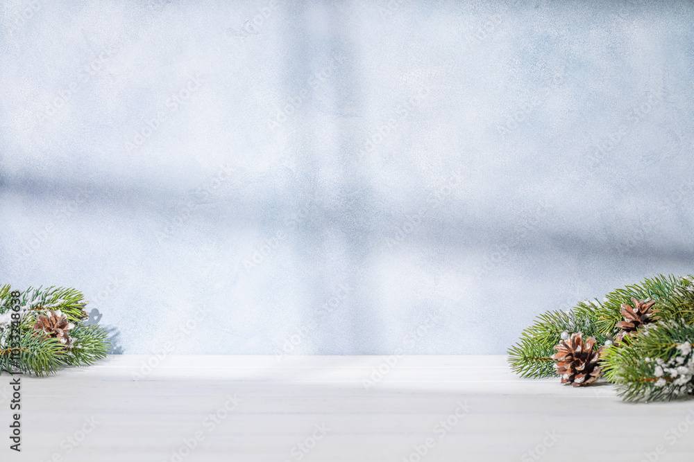 Aufkleber christmas template featuring snowy fir tree branches on a table with shadows and sun glares softly f