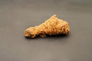 Fried Chicken breast hot crispy strips crunchy chicken tenders three pieces isolated on black background. Crispy fried chicken is a food made from fried chicken placed on a plate.
