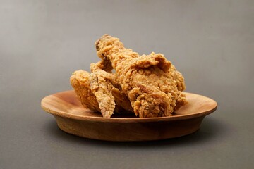 Fried Chicken breast hot crispy strips crunchy chicken tenders three pieces isolated on black background. Crispy fried chicken is a food made from fried chicken placed on a plate.
