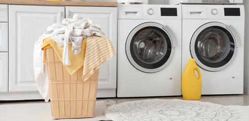 Basket with clothes in laundry room