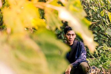 Pensive Male Sitting, Gazing at the Camera with Depth. Joyful Male Exploring and Enjoying the...