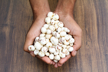Fox nuts or makhaana holding with hand 