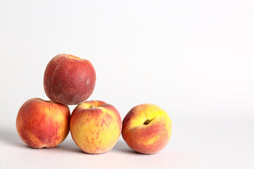 Sweet peaches on white background