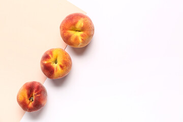 Sweet peaches on colorful background