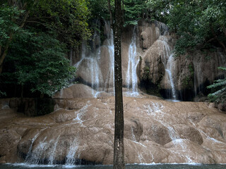 Landscape of beautiful waterfall in the tropical forest. The level of limestone with waterfalls