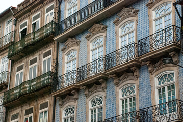 Facade of typical Portuguese houses in Porto with tiles - Portugal 