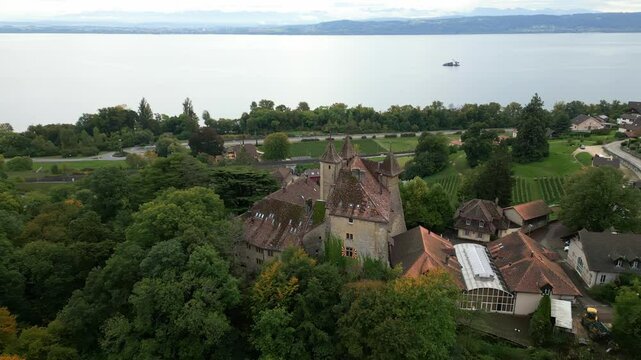 Pull out establishing drone shot of Vaumarcus Castle in Canton of Neuchatel Switzerland