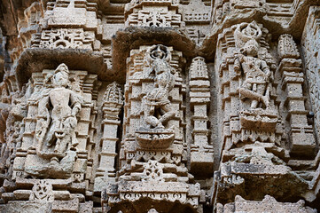 Carved idols on the outer wall of Shri Kapileshwar Mahadev Mandir, Velhale, near Bhusawal, Maharashtra, India