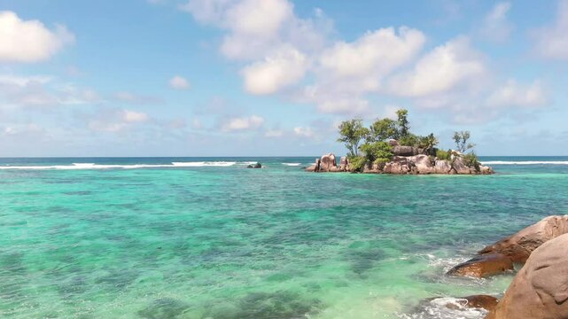 Small island Ile Souris, Island Mahe, Republic of Seychelles, Africa.   
Small island Ile Souris at Anse Royal Beach, Island Mahe, Seychelles.   
