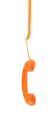 vintage orange telephone handset with cord isolated on white background