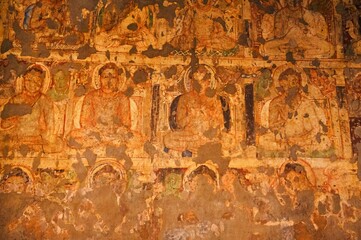 Cave No. 19. Painted Buddhas on the right wall of the Chaitya.  Ajanta Caves, Aurangabad, Maharashtra, India