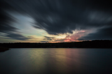 long exposure, sunset, blurry clouds, blurry water surface, example of using a photo filter, ND filter, tripod photography, horizon, evening, light, beautiful, reflection, colorful