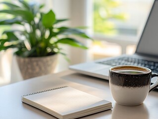 Coffee cup, notebook on desk, blurred green plant background, cozy workspace, productive office, sunlight through window