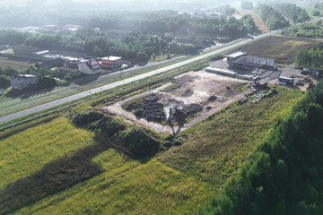 Piles of Construction Waste on Dirt Ground from Above