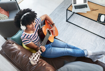 Woman, song and passion with guitar at home for music, production or hobby performance. Girl,...