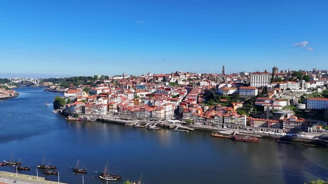 Porto, Portugal. Aerial view of the old city with promenade of the Douro river and old bridge.