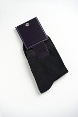 New black socks with blank label on a white background with copy space