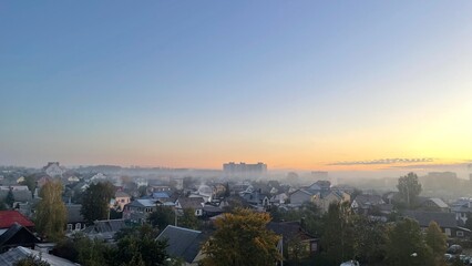 autumn morning covered with fog of city residents
