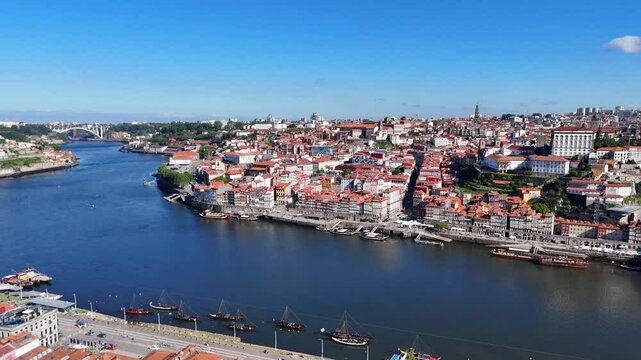 Porto, Portugal. Aerial view of the old city with promenade of the Douro river and old bridge.