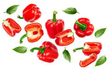 flying red sweet bell pepper with cut slices and green leaves isolated on white background. clipping path