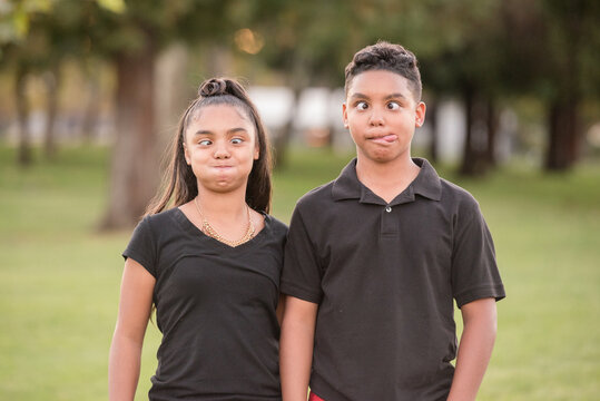 Brother and sister making silly faces