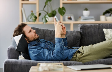House, relax and man on sofa, smartphone and typing with break, connection and social media....