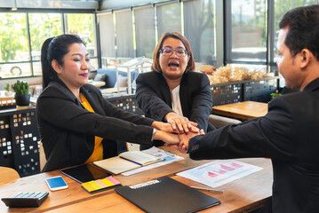 Group of people United Hands to built teamwork together with Spirit - teamwork concepts.